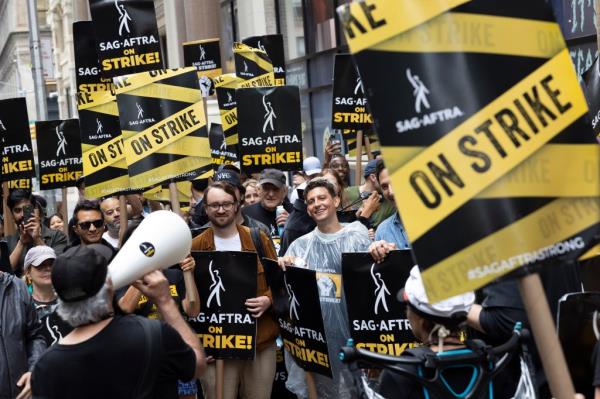 Members of SAG-AFTRA and supporters picket at Warner Bros. Discovery and Netflix Headquarters in Manhattan on Oct. 6, 2023.